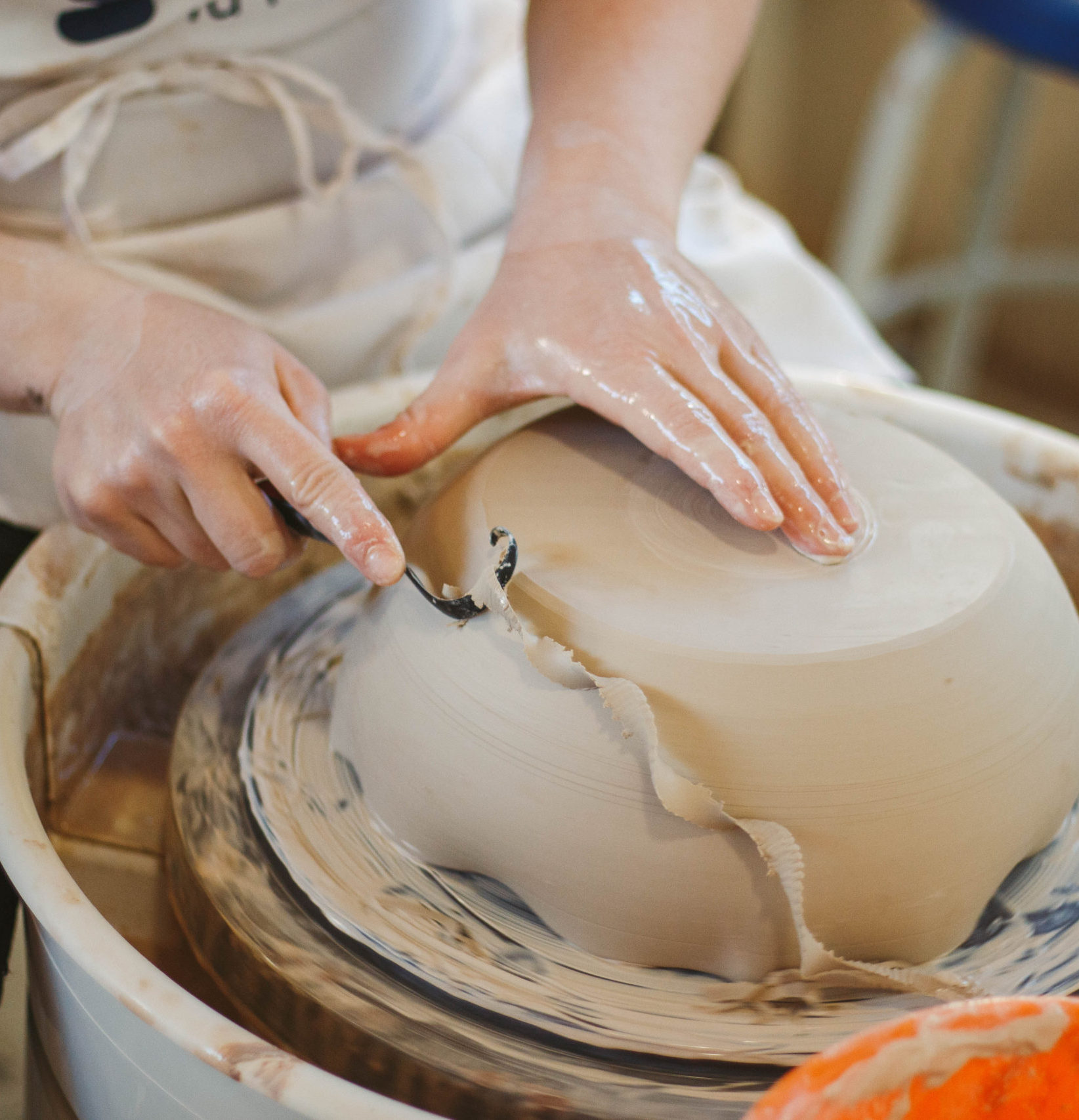 Tools being used on clay bowl